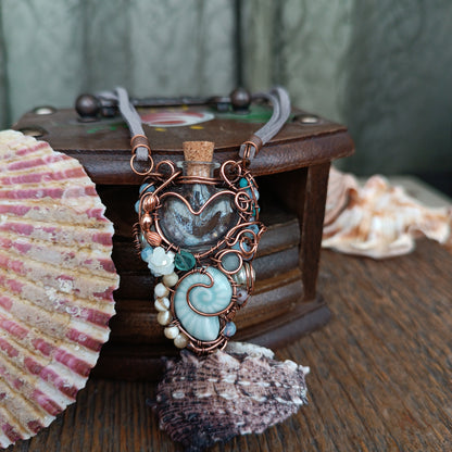 Heart of the ocean. Reversible vial necklace