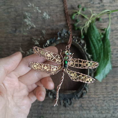 Large green dragonfly with golden cogs.