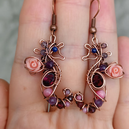 Seahorse dangling earrings.