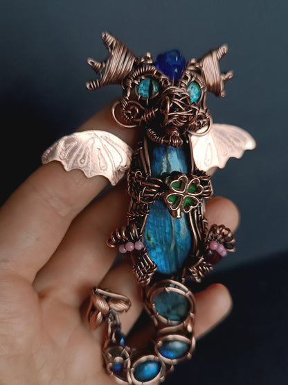 Blue baby dragon with shamrock necklace.