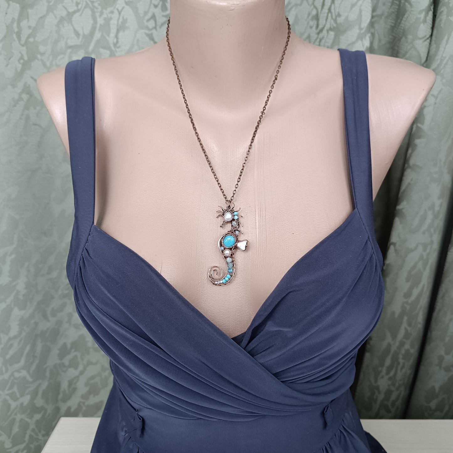 Blue and white seahorse pendant
