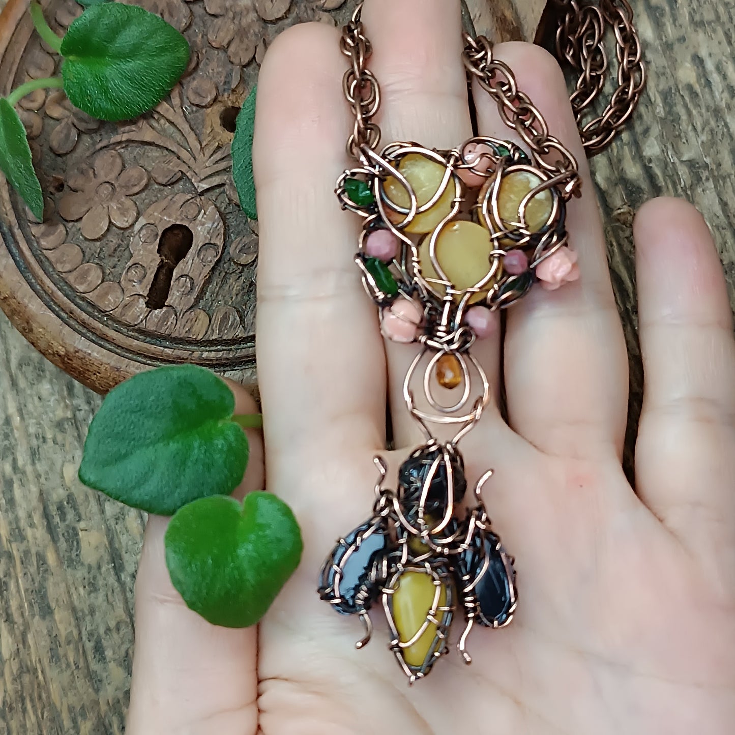 Honey bee pollinating in the rose garden. Necklace.