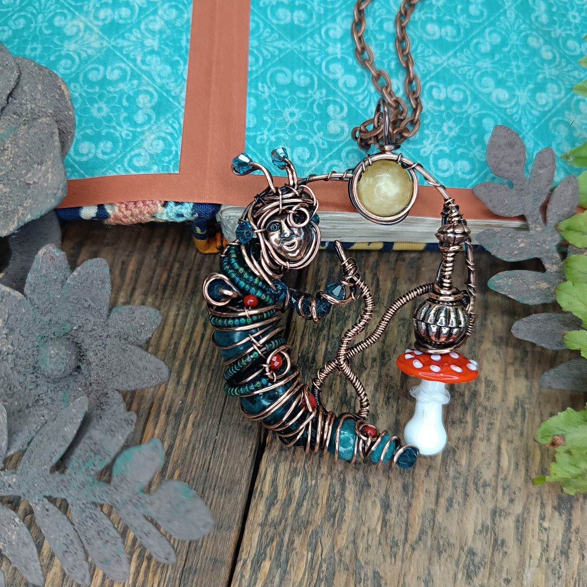 Blue caterpillar necklace