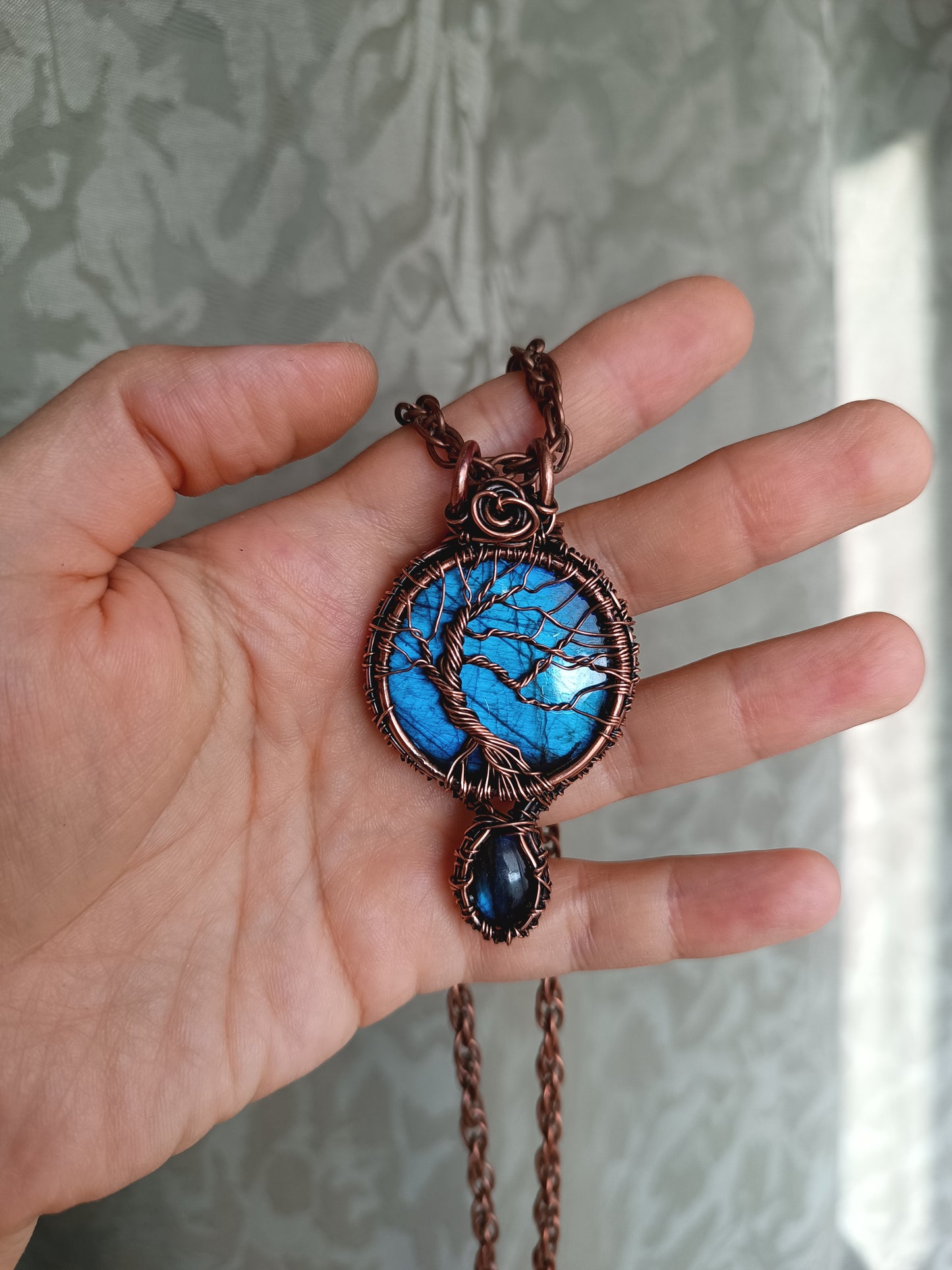 Three tree of life necklaces.