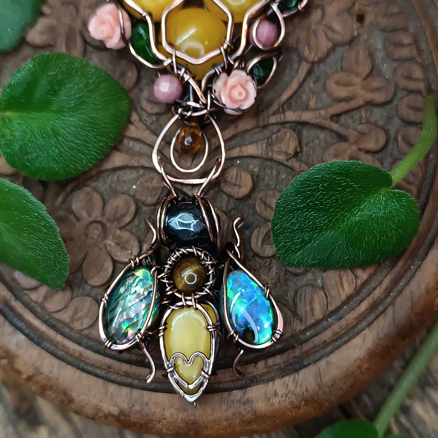 Honey bee pollinating in the rose garden. Necklace.