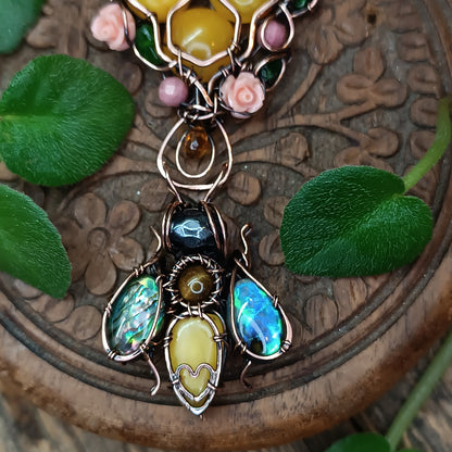 Honey bee pollinating in the rose garden. Necklace.