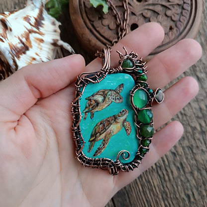 Aquatic adventure 🐢🦦 Hand painted wire wrapped necklace. 2 sided.