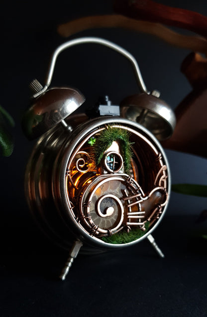 Snail fairy house. Mini world in a clock. Steampunk decor with light.