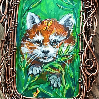 Red panda and a butterfly necklace. Reversible.