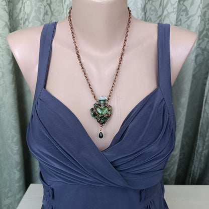 Green heart vial necklace