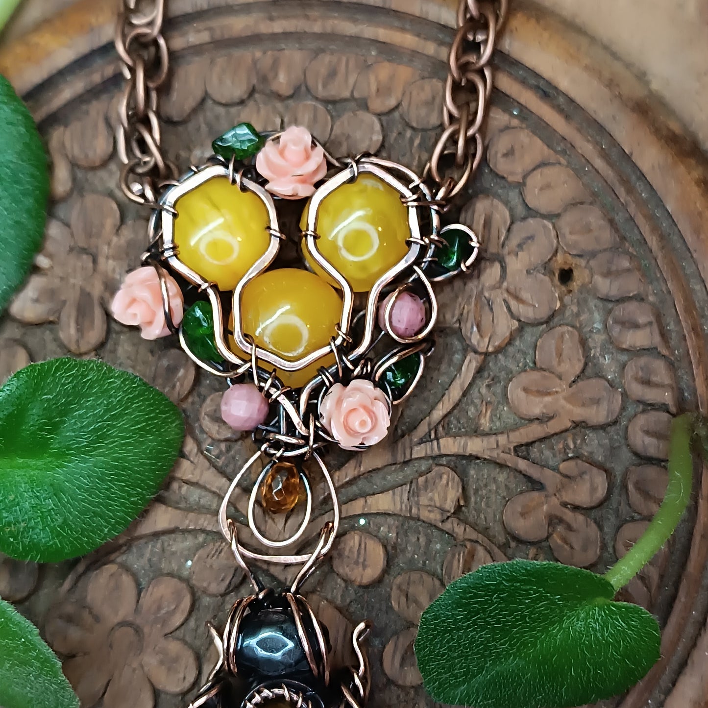 Honey bee pollinating in the rose garden. Necklace.