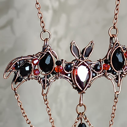 Scarlet dance. Bat necklace.