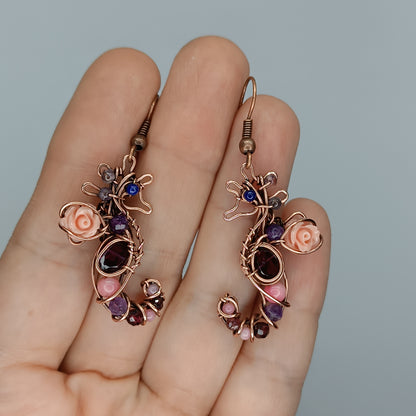 Seahorse dangling earrings.