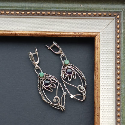 Silver dangling earrings. Amethyst bells.
