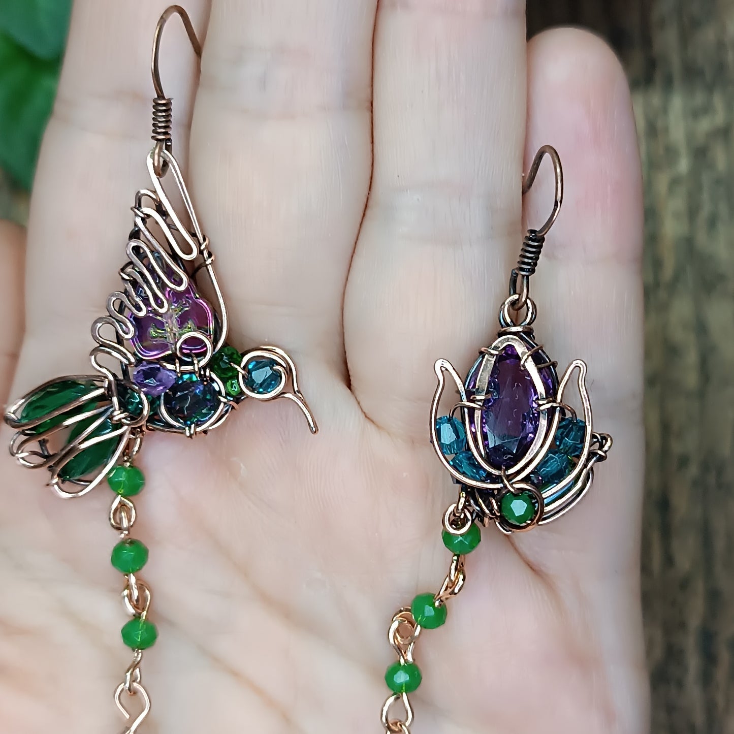 Humming bird and flower dangling earrings.