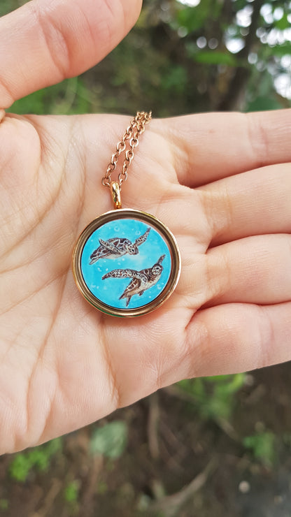 Mini reversible Mermaid and sea turtles pendant.