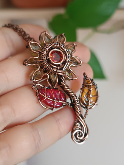 Sunflower pendant with red leaf