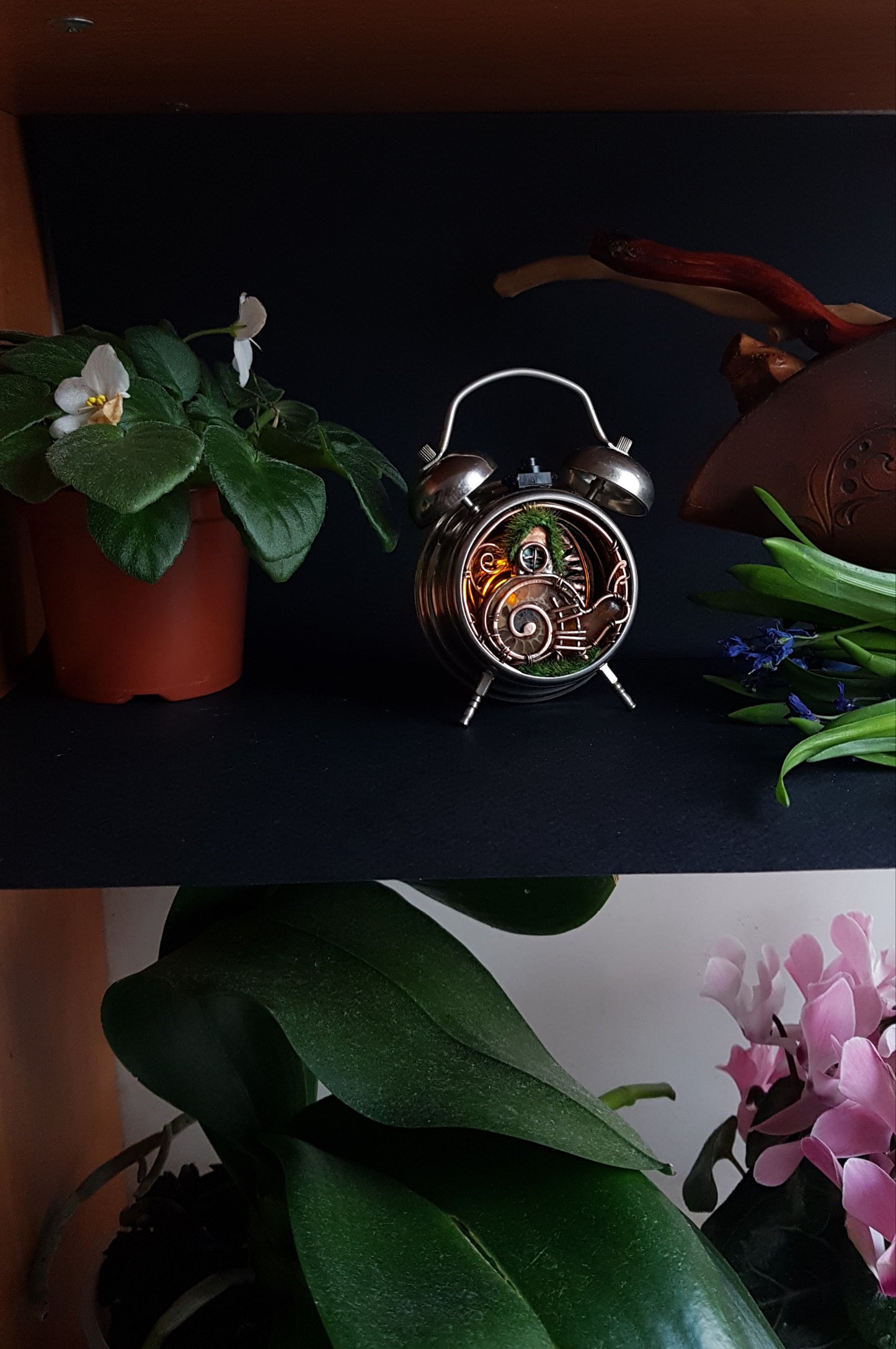 Snail fairy house. Mini world in a clock. Steampunk decor with light.