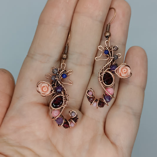 Seahorse dangling earrings.