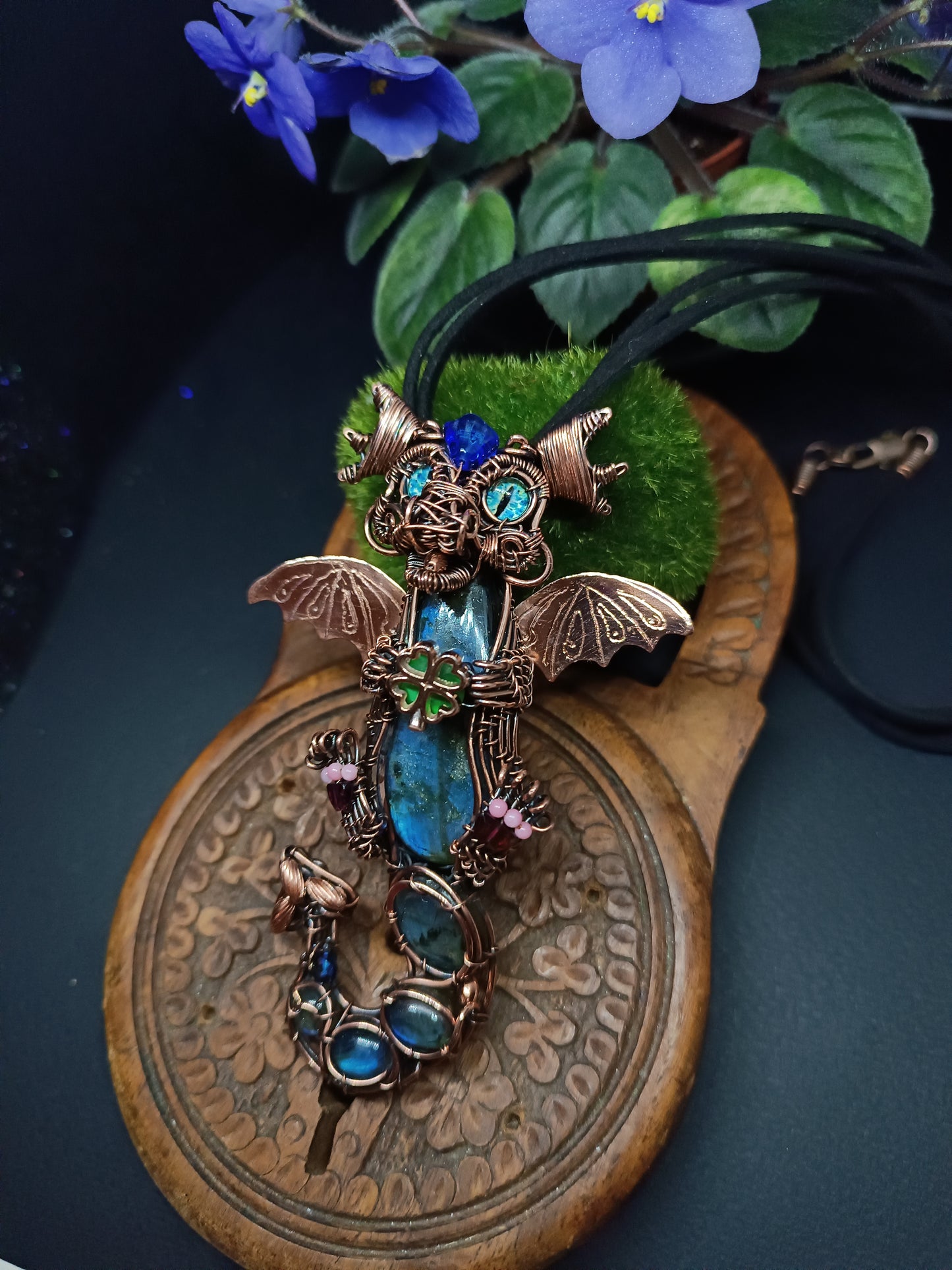 Blue baby dragon with shamrock necklace.