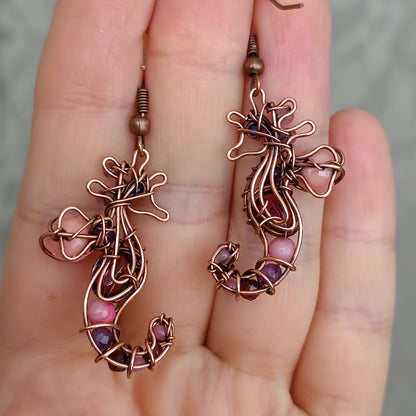 Seahorse dangling earrings.