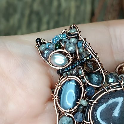 Sweet puppy. Detailed wire wrapped and beaded pendant.