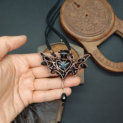 Black (with some purple) bat bottle necklace