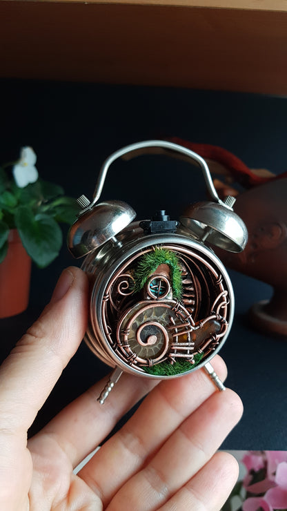 Snail fairy house. Mini world in a clock. Steampunk decor with light.