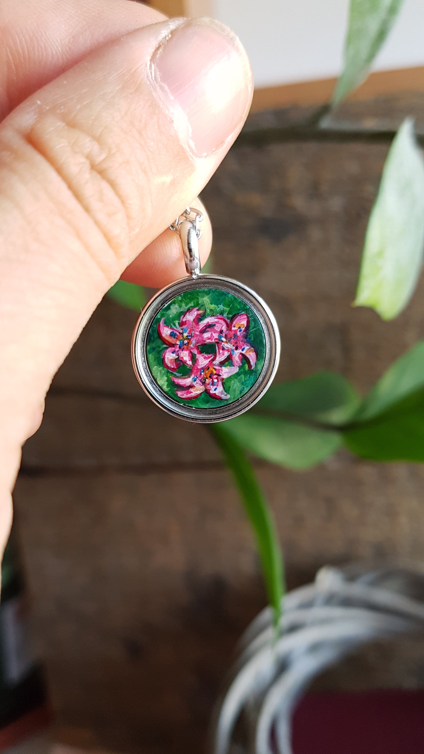 Hummingbird and pink flowers. Double sided mini locket.