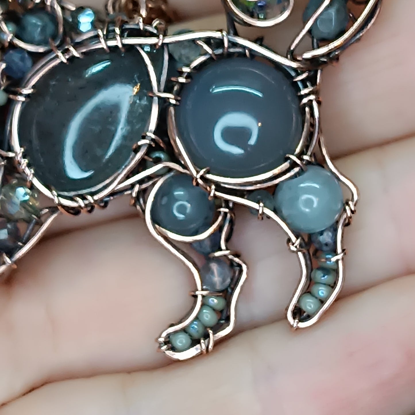 Sweet puppy. Detailed wire wrapped and beaded pendant.