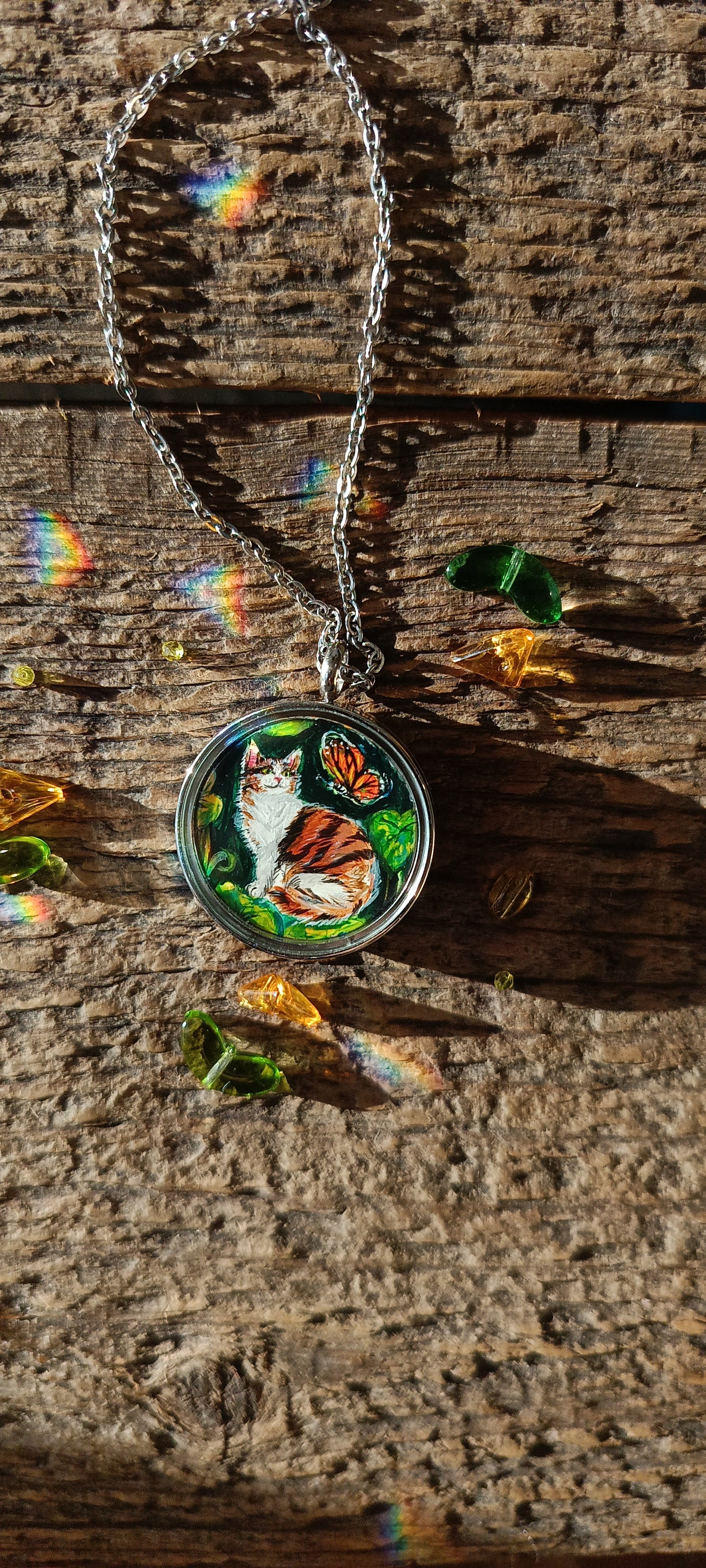 Cat admiring butterflies. Pendant.
