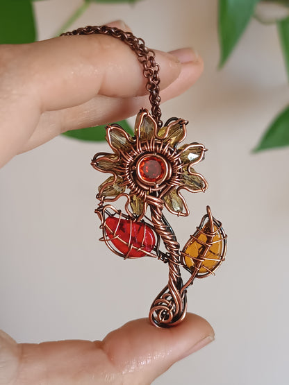 Sunflower pendant with red leaf