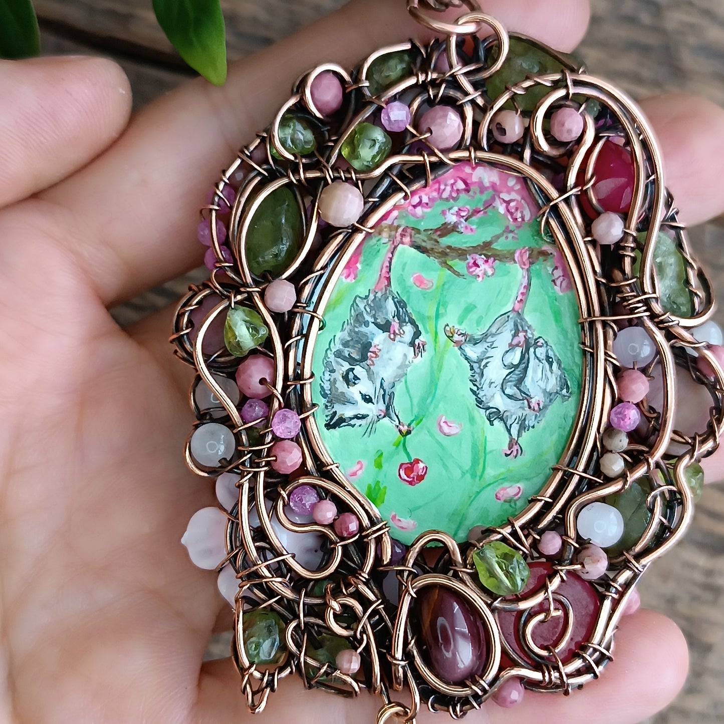 Charming possums and cherry blossom. Wire wrapped 2 sided necklace with miniature paintings