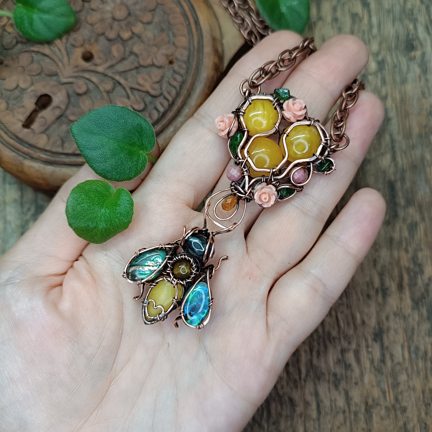 Honey bee pollinating in the rose garden. Necklace.