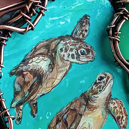 Aquatic adventure 🐢🦦 Hand painted wire wrapped necklace. 2 sided.
