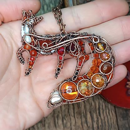 Swoopy tail Foxy. Sparkly wire wrapped pendant.