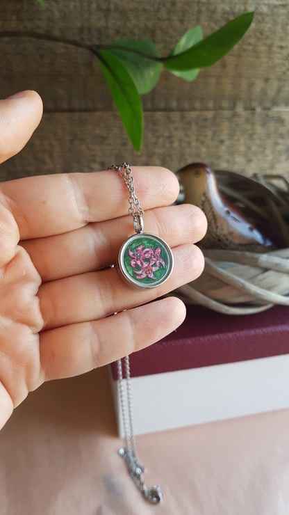 Hummingbird and pink flowers. Double sided mini locket.