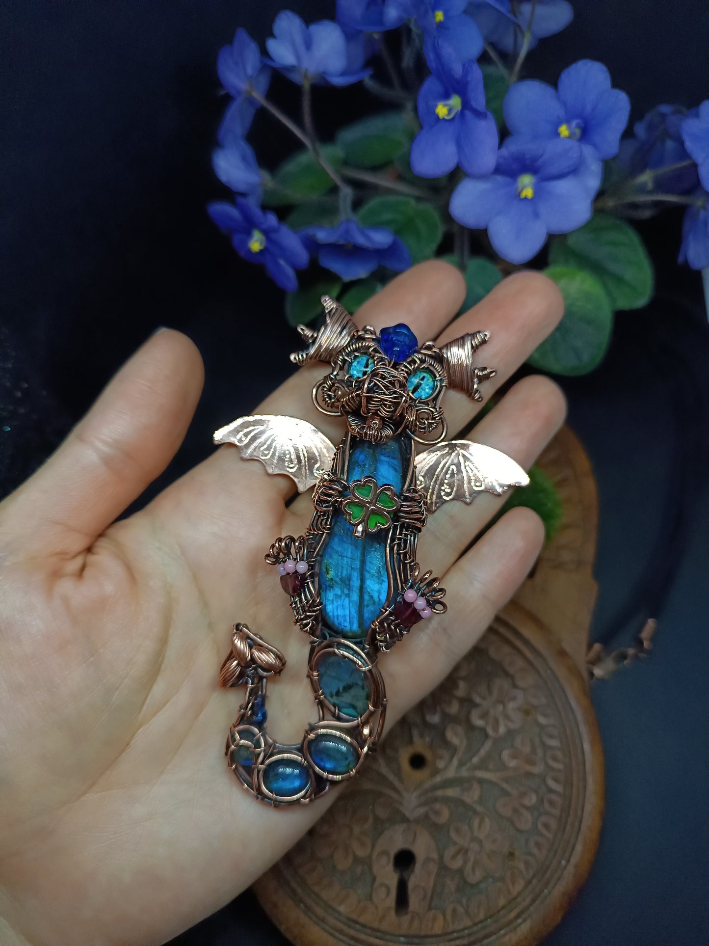 Blue baby dragon with shamrock necklace.