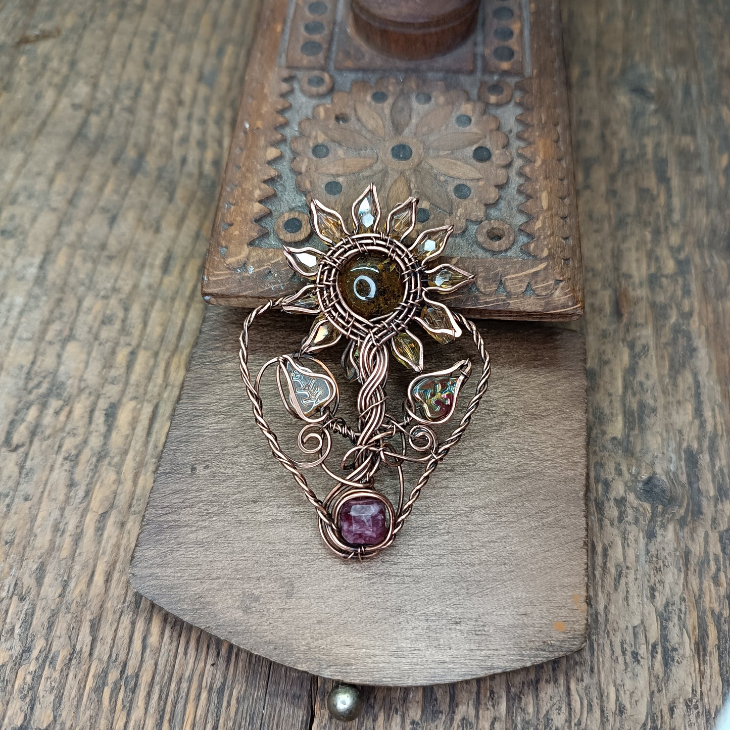 Sunflower pendant with garnet root