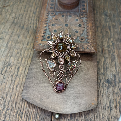 Sunflower pendant with garnet root