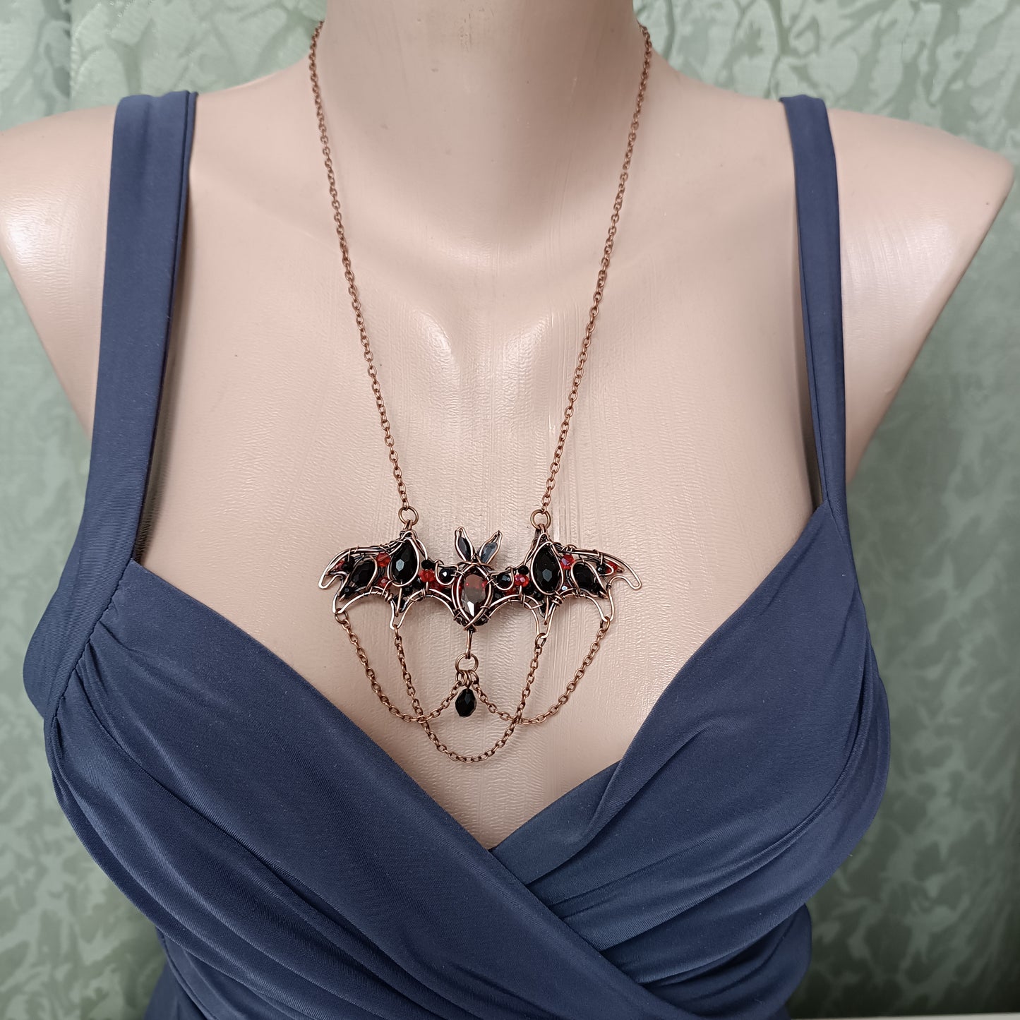 Scarlet dance. Bat necklace.