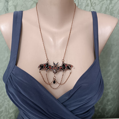Scarlet dance. Bat necklace.