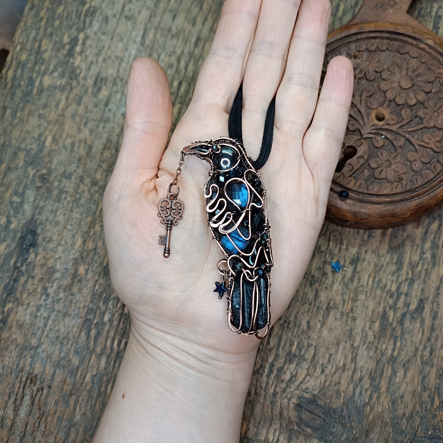 Secret keeper. Raven with the blue star. Wire wrapped necklace