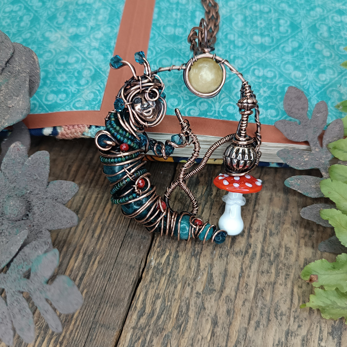 Blue caterpillar necklace
