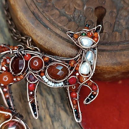 Swoopy tail Foxy. Sparkly wire wrapped pendant.