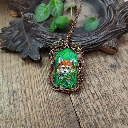Red panda and a butterfly necklace. Reversible.