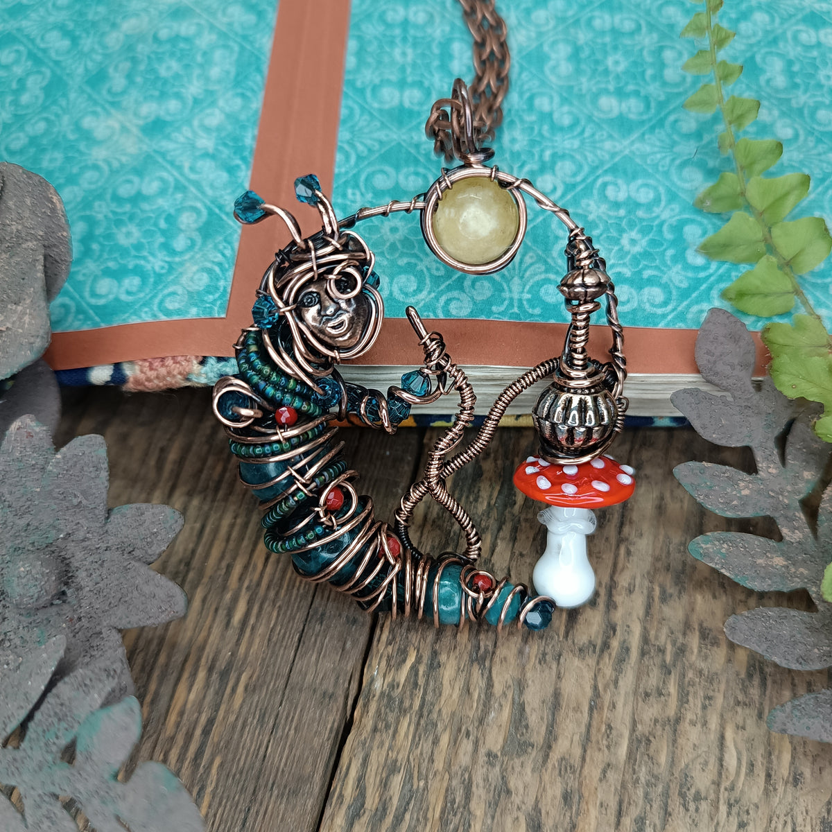 Blue caterpillar necklace
