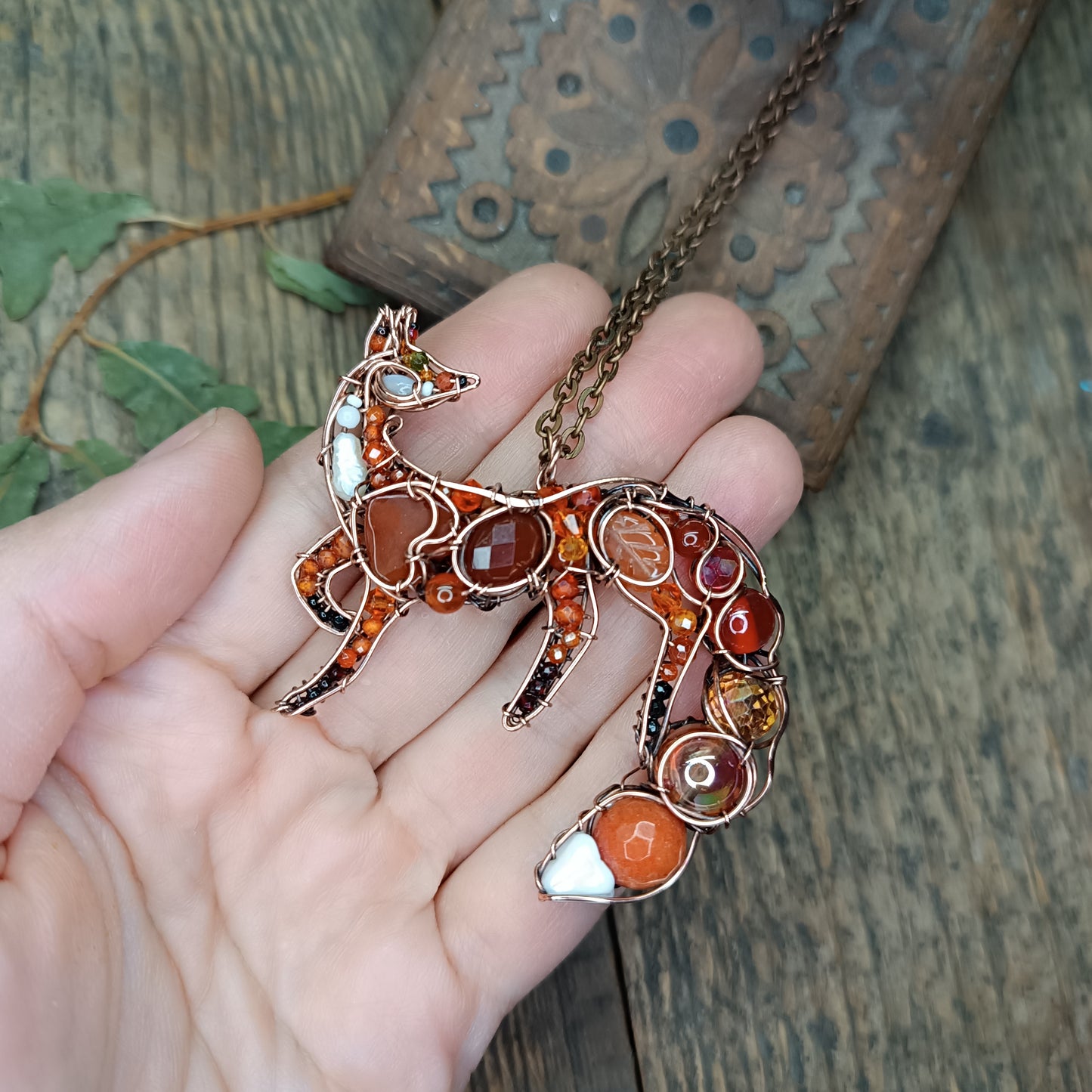 Foxy the swoopy tail! Copper necklace with carnelians.
