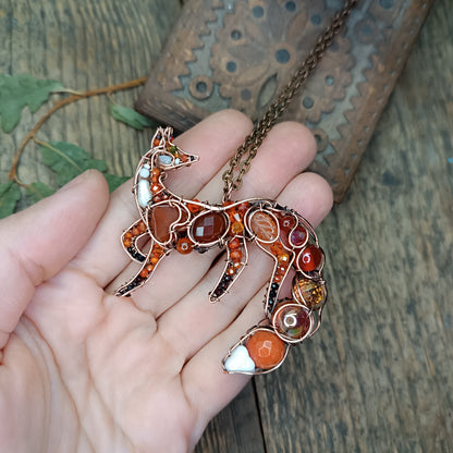 Foxy the swoopy tail! Copper necklace with carnelians.
