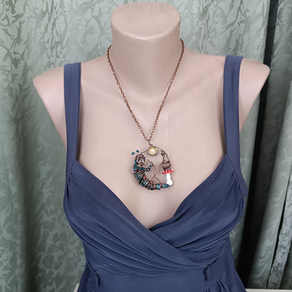 Blue caterpillar necklace
